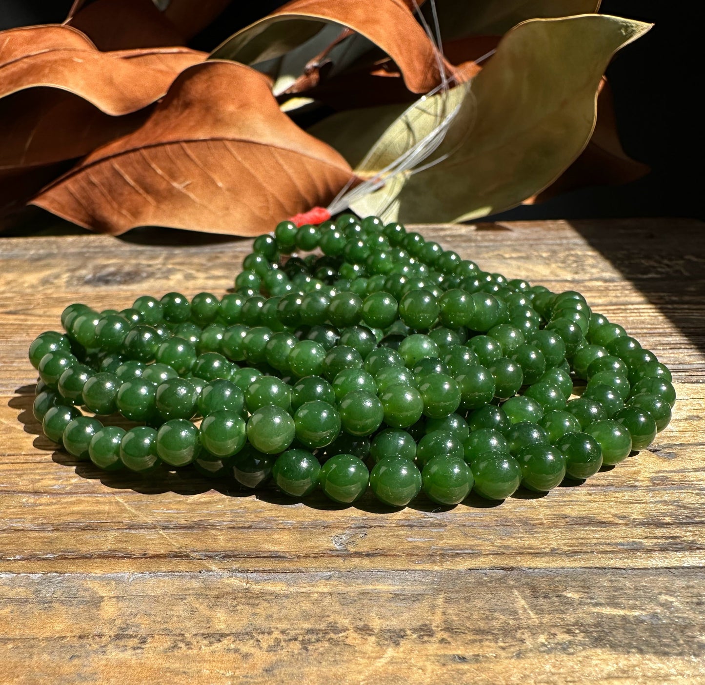 A Grade 7mm Nephrite Jade Beads, unstrung 16"