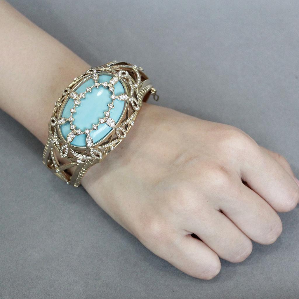 LO4348 - Gold Brass Bangle with Synthetic in Sea Blue