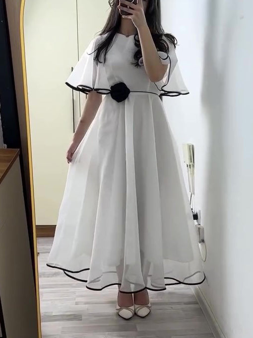 White Chiffon Maxi Dress With Black Trim And Floral Accent