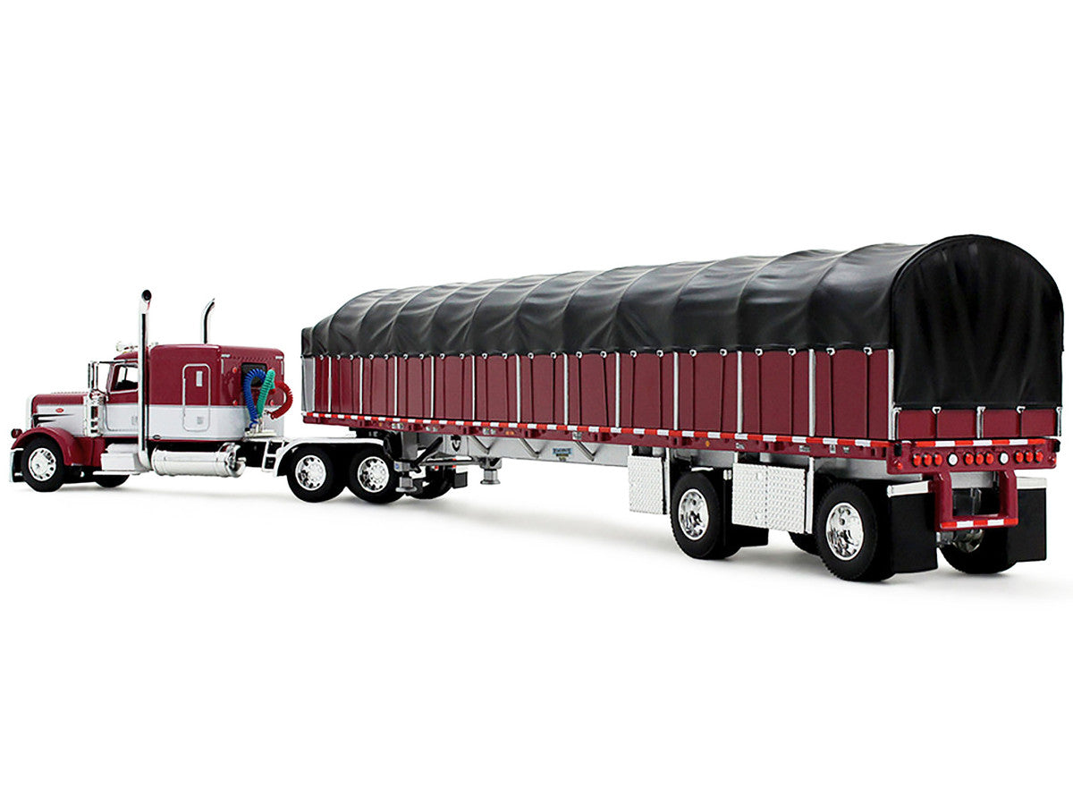 Peterbilt 389 with 63" Flat Top Sleeper and 53’ Wilson Roadbrute Flatbed Trailer with Covered Wagon Maroon with White Stripes 1/64 Diecast Model by DCP/First Gear