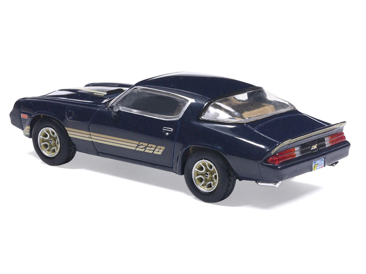 1981 Chevrolet Camaro Z28 Dark Blue Metallic with Gold Stripes and Interior 1/64 Diecast Model Car by IXO Models