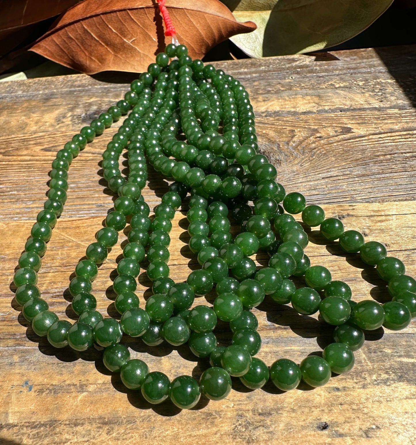 A Grade 7mm Nephrite Jade Beads, unstrung 16"