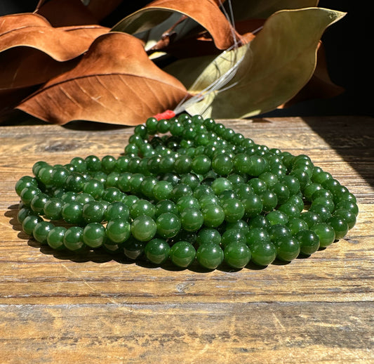 A Grade 7mm Nephrite Jade Beads, unstrung 16"
